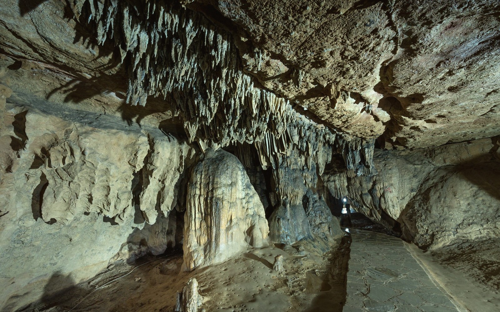 Limestone cavern formations lit from below